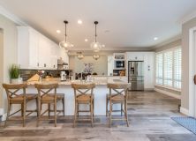 Four Brown Wooden Chairs 2635038 (1)